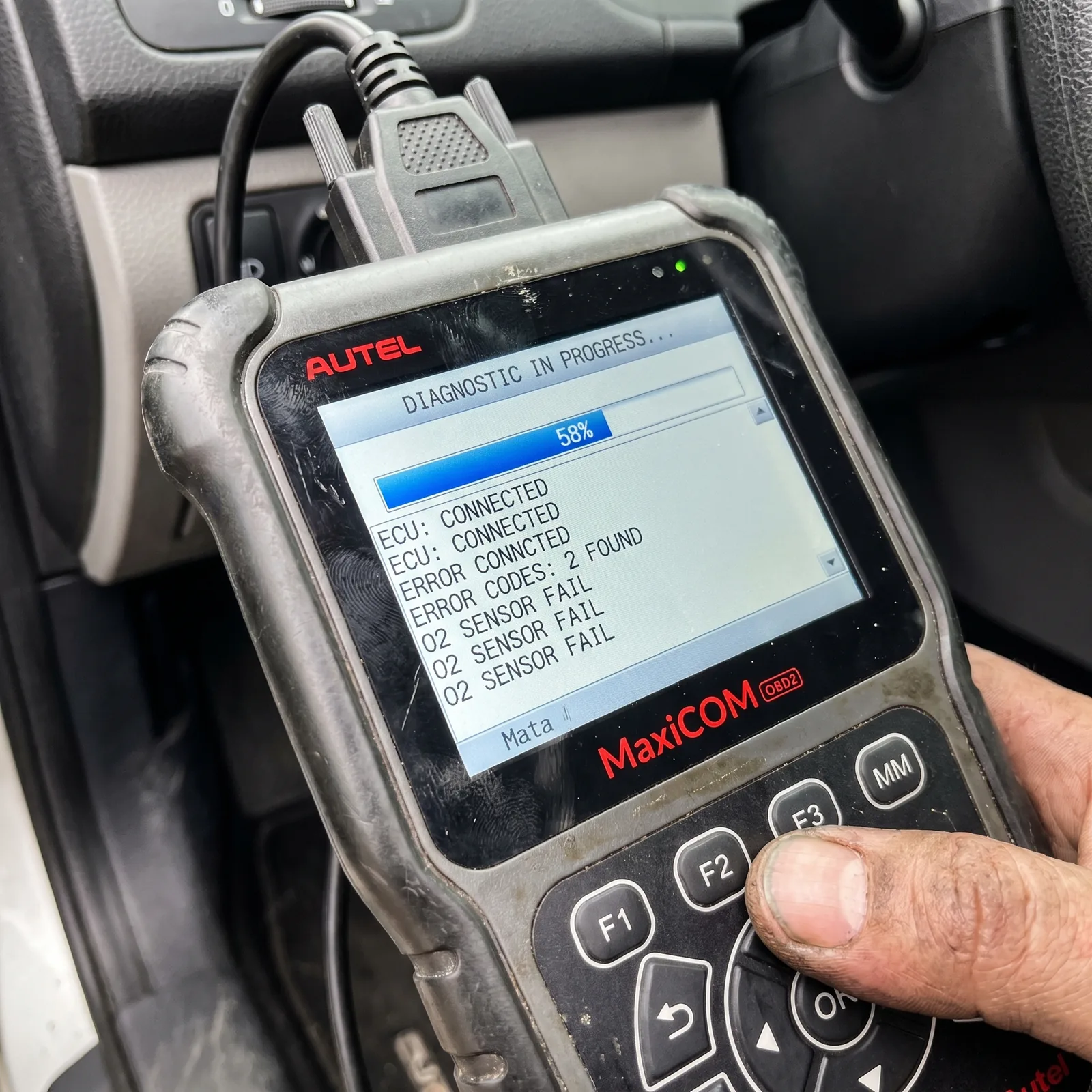 Scan tool reading live fault codes from a vehicle's ECU at Jack's &mdash; how a check-engine light gets diagnosed